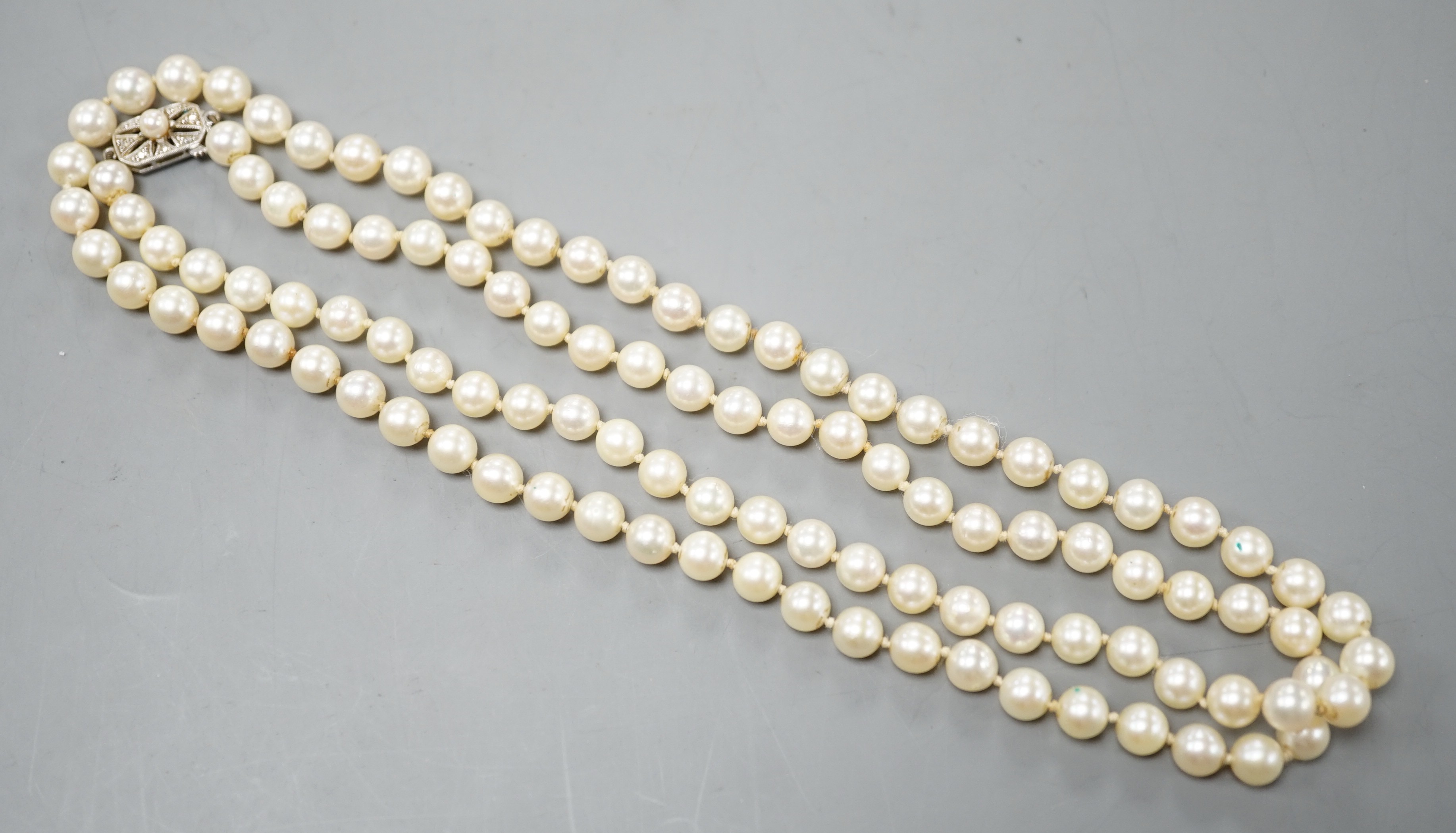 A long single strand cultured pearl necklace with cultured pearl set 9ct white gold clasp, 75cm.